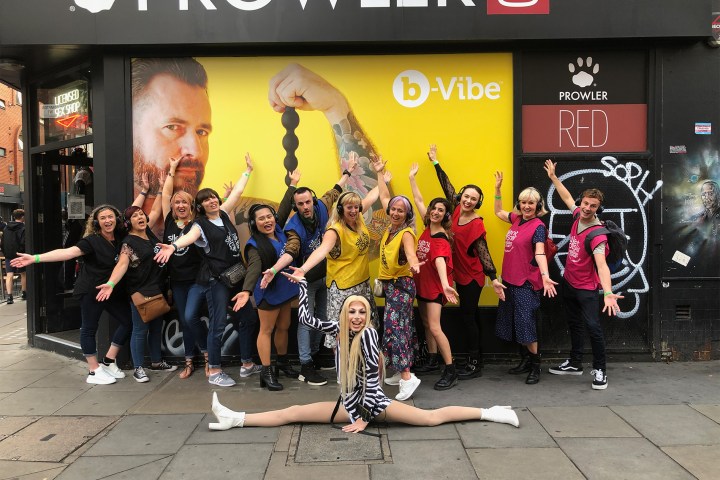 a group of people standing in front of a building